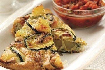 Spanish tortilla with spicy tomato sauce