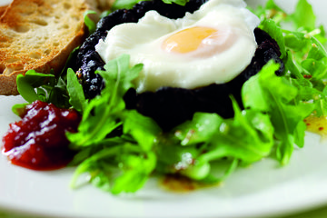 Black pudding with a poached egg