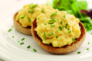 Scrambled eggs on toasted wholemeal muffins